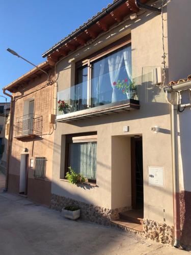 a building with a window with plants on it at Vistas de Chamberi in Alhama de Aragón