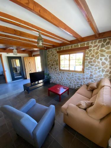 a living room with a couch and a table at La cara Luna in Santa Brígida