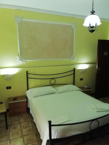 Katil atau katil-katil dalam bilik di Hotel La Carina