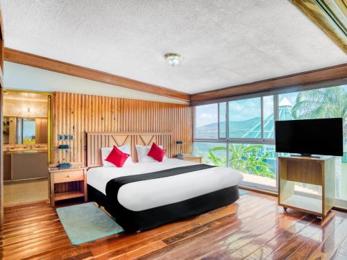 Postel nebo postele na pokoji v ubytování Hotel y Spa Posada Mirador