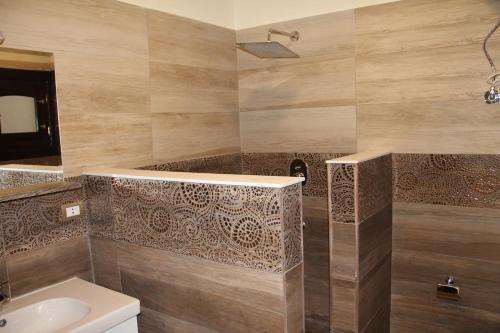 a bathroom with a toilet and a sink and a shower at The View El Quseir in Quseir