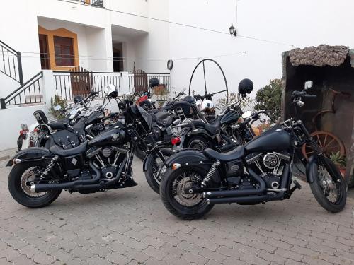 a row of motorcycles parked next to a building at Sol da Vila in Vila Nova de Milfontes