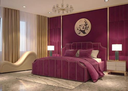 a purple bedroom with a large bed with purple walls at The wiltons hotel in Nam Ðịnh