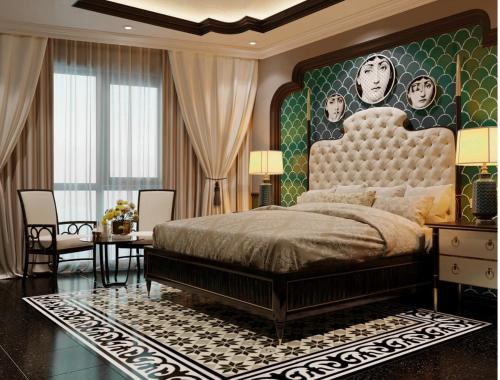 a bedroom with a large bed with a painting on the wall at The wiltons hotel in Nam Ðịnh