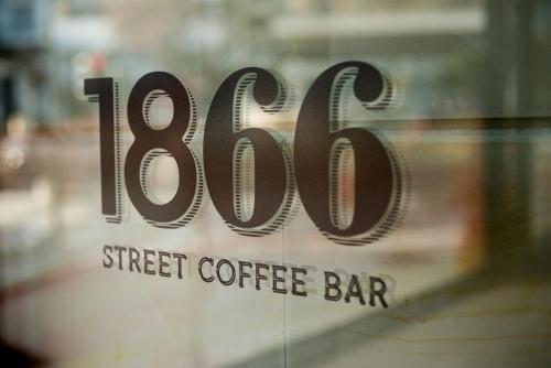a sign for a street coffee bar on a window at Olympic Hotel in Heraklio Town