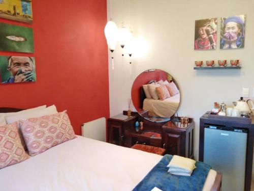 Ein Bett oder Betten in einem Zimmer der Unterkunft Bramasole Boutique Hotel