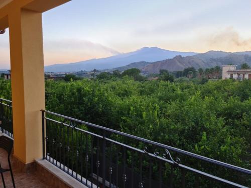 a balcony with a view of the mountains at B&B Villa Chiara - Bed And Breakfast in Taormina