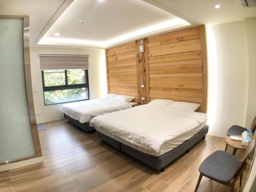 Postel nebo postele na pokoji v ubytování Alishan Zhuqi Homestay #57