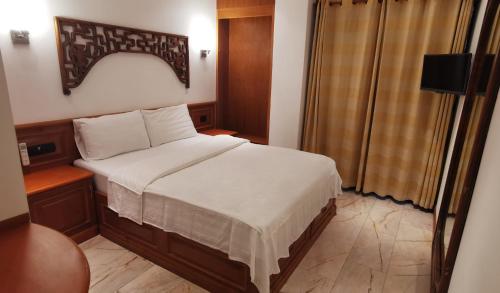 Postel nebo postele na pokoji v ubytování Max Residence