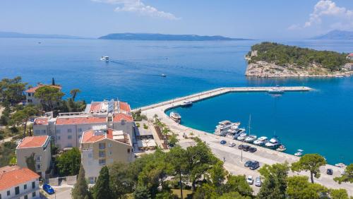 an aerial view of a bay with a harbor at Hotel Osejava in Makarska