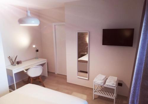 Ein Bett oder Betten in einem Zimmer der Unterkunft Due Rioni Bed and Breakfast