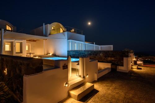 a house with the moon in the sky at Soil of Sun Luxury Villas in Megalokhori