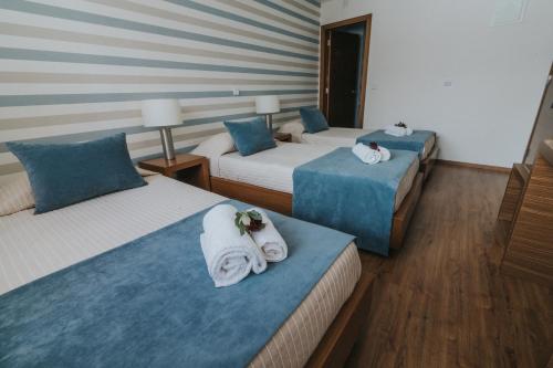 Letto o letti in una camera di Hotel Nossa Senhora de Lurdes