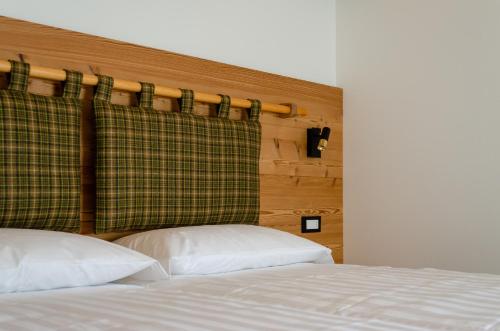 Letto o letti in una camera di Bioagritur La Casa dei Trajeri