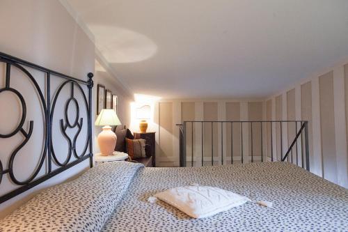 a bedroom with a bed with a iron bed frame at Malvarina in Capodacqua
