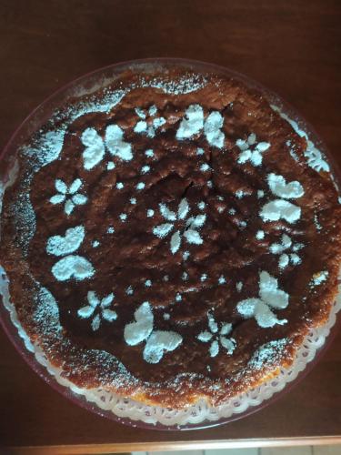 a chocolate cake sitting on top of a table at Fra Bosco e Cielo B&B in Mercato Saraceno