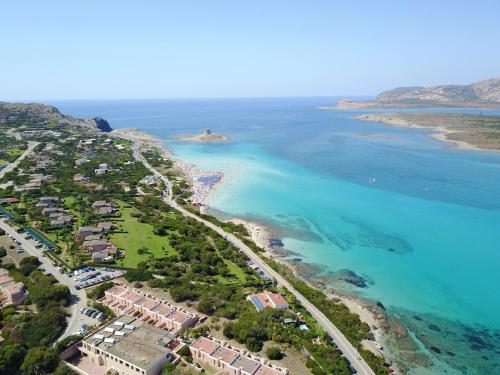 an aerial view of a beach and the ocean at Club Esse Sporting in Stintino