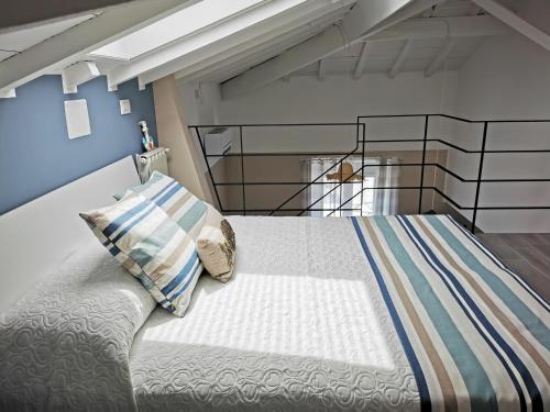 a bedroom with a bed with a pillow on it at Tuffonelblu in Ventimiglia