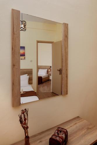 a mirror on a wall in a bedroom at Aurora in Potos