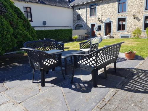 a group of tables and chairs on a patio at La Source d'Arimont in Malmedy