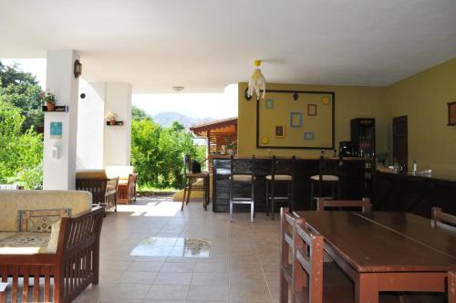 a dining room with a table and chairs at San Simon Hotel in Cıralı