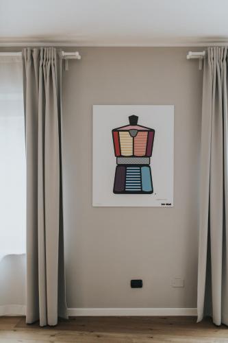 a drawing of a coffee maker on a wall at Bed's Apartments in Soave