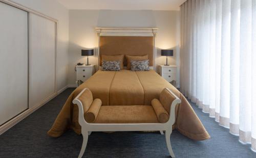 Tempat tidur dalam kamar di Hotel Afonso V & SPA