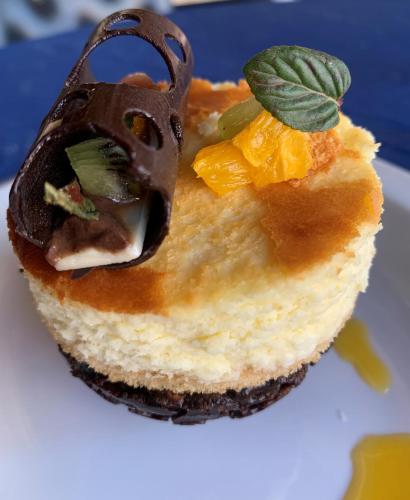 a piece of cake with chocolate on top on a plate at San Francisco Lodge in Los Andes