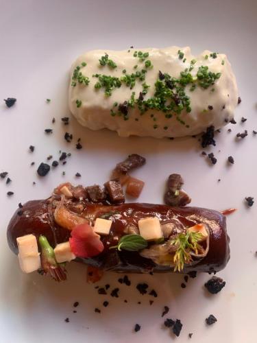 two food items on a white plate on a table at San Francisco Lodge in Los Andes