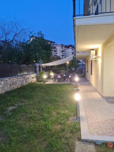 a courtyard of a house at night with lights at B&B Villa Chiara - Bed And Breakfast in Taormina