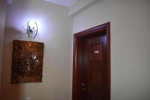 a room with a door and a picture on the wall at Villa Mia Suites in Ohrid