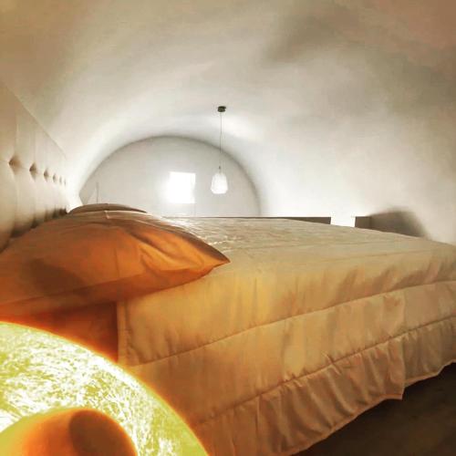 a bedroom with a large bed in a room at Villa Francesca - Manfredi Homes&Villas in Monte SantʼAngelo