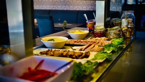 a buffet with many different types of food on a table at Fosen Fjord Hotel in Å i Åfjord