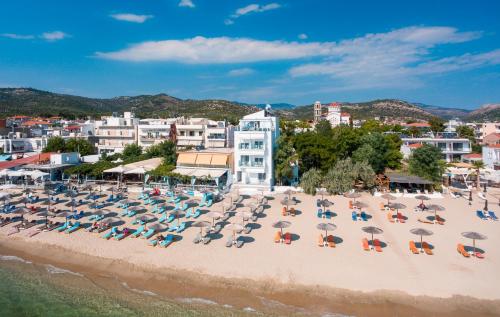 an aerial view of a beach with chairs and umbrellas at Mr & Mrs K Bianco in Potos