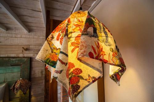 a colorful kite hanging from a wall at Latica Lodge in Playa Negra
