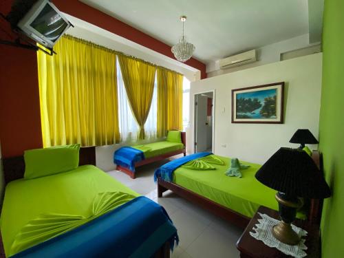 Postel nebo postele na pokoji v ubytování Hostal Puerto Azul