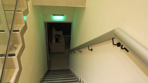 a hallway with a stairway with a stair railing at Hotel Lido in Mar del Plata