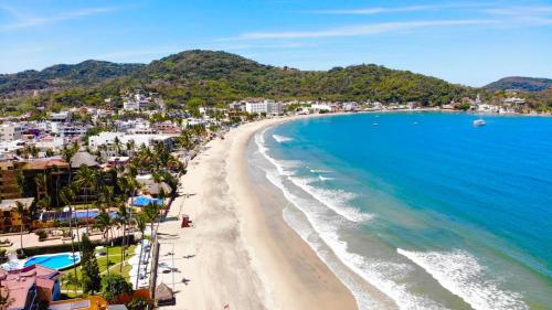an aerial view of a beach and the ocean at Bungalows Maria Teresa in Rincon de Guayabitos