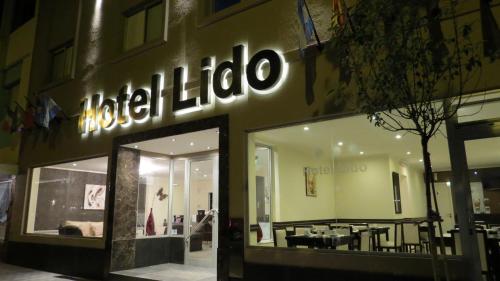 a store front with a sign that reads hotel libello at Hotel Lido in Mar del Plata
