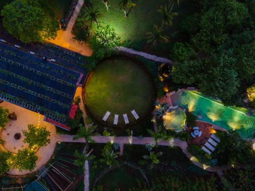 an overhead view of a pool and a resort at night at Latica Lodge in Playa Negra