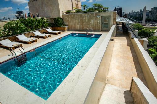 a swimming pool on top of a building at Hotel Grand Brizo Buenos Aires in Buenos Aires
