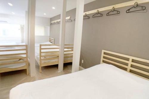 Ένα ή περισσότερα κρεβάτια σε δωμάτιο στο Sunstay - Shinbamba 1