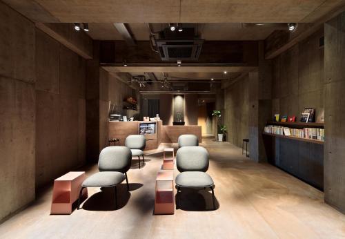 a salon with chairs and a waiting room at BUNSHODO HOTEL in Fukuoka