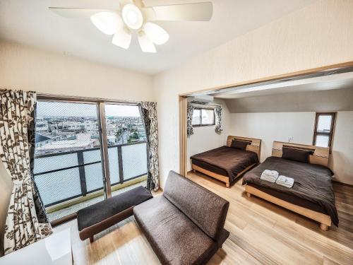 Postel nebo postele na pokoji v ubytování Terrace Resort Chatan West