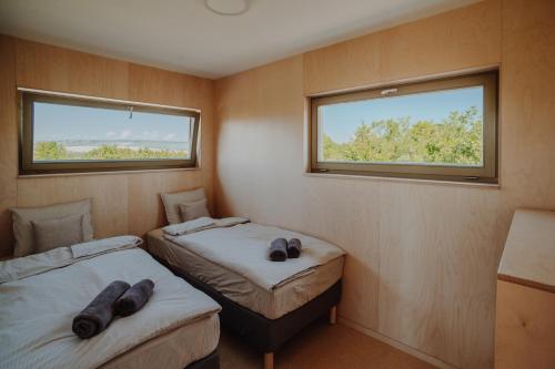 Postel nebo postele na pokoji v ubytování Šaldorfské domky