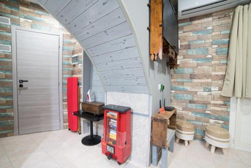 a gas station with a brick wall at Casa Eulalia in Cagliari