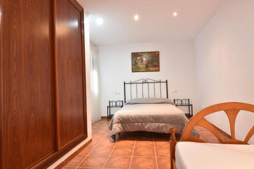 En eller flere senge i et værelse på El Rincón de Ramón
