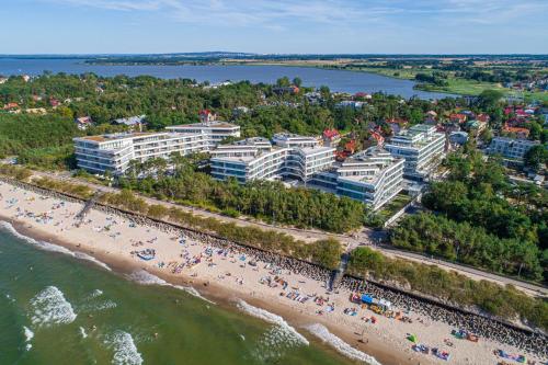 an aerial view of a beach and buildings at Dune Resort Mielno - C in Mielno