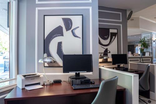 an office with a desk with a computer and a printer at Best Western Dorchester Hotel in Nanaimo
