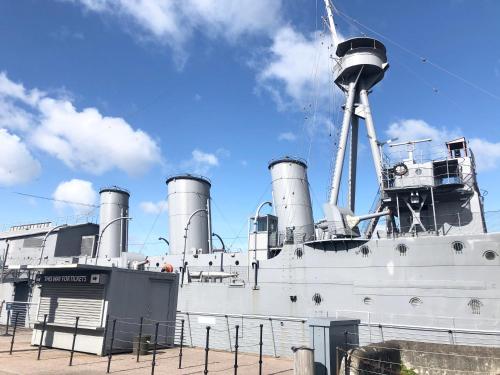 a large white ship with smoke stacks on it at CK Serviced Apartments Belfast in Belfast
